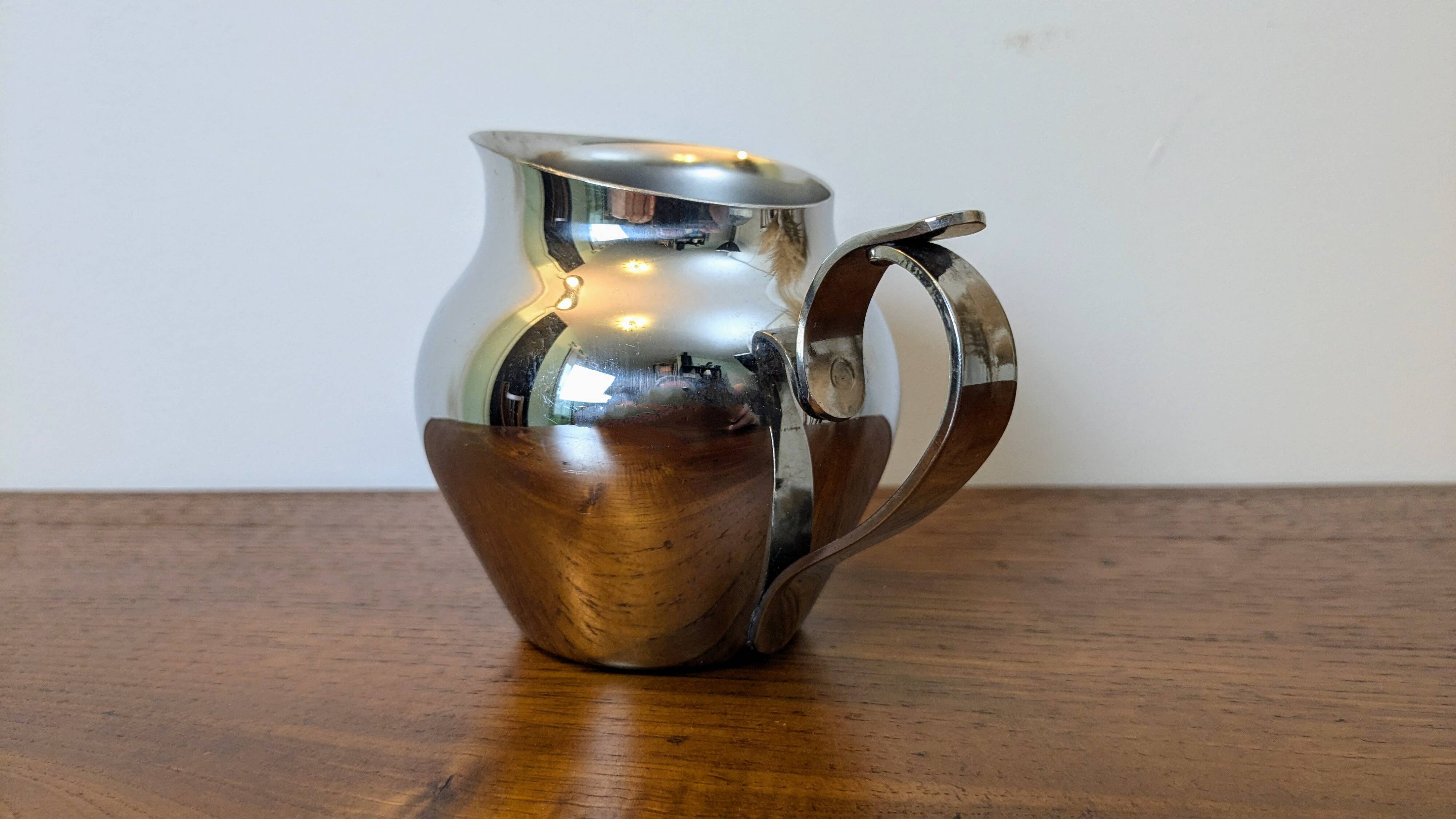 Antique stainless steel milk jug by Remy Letang