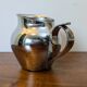 Antique stainless steel milk jug by Remy Letang