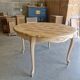 Round table made of cherry wood, sanded and varnished.