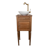 Small antique washbasin in wood and red marble.