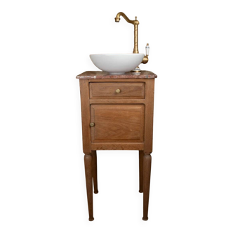 Small antique washbasin in wood and red marble.
