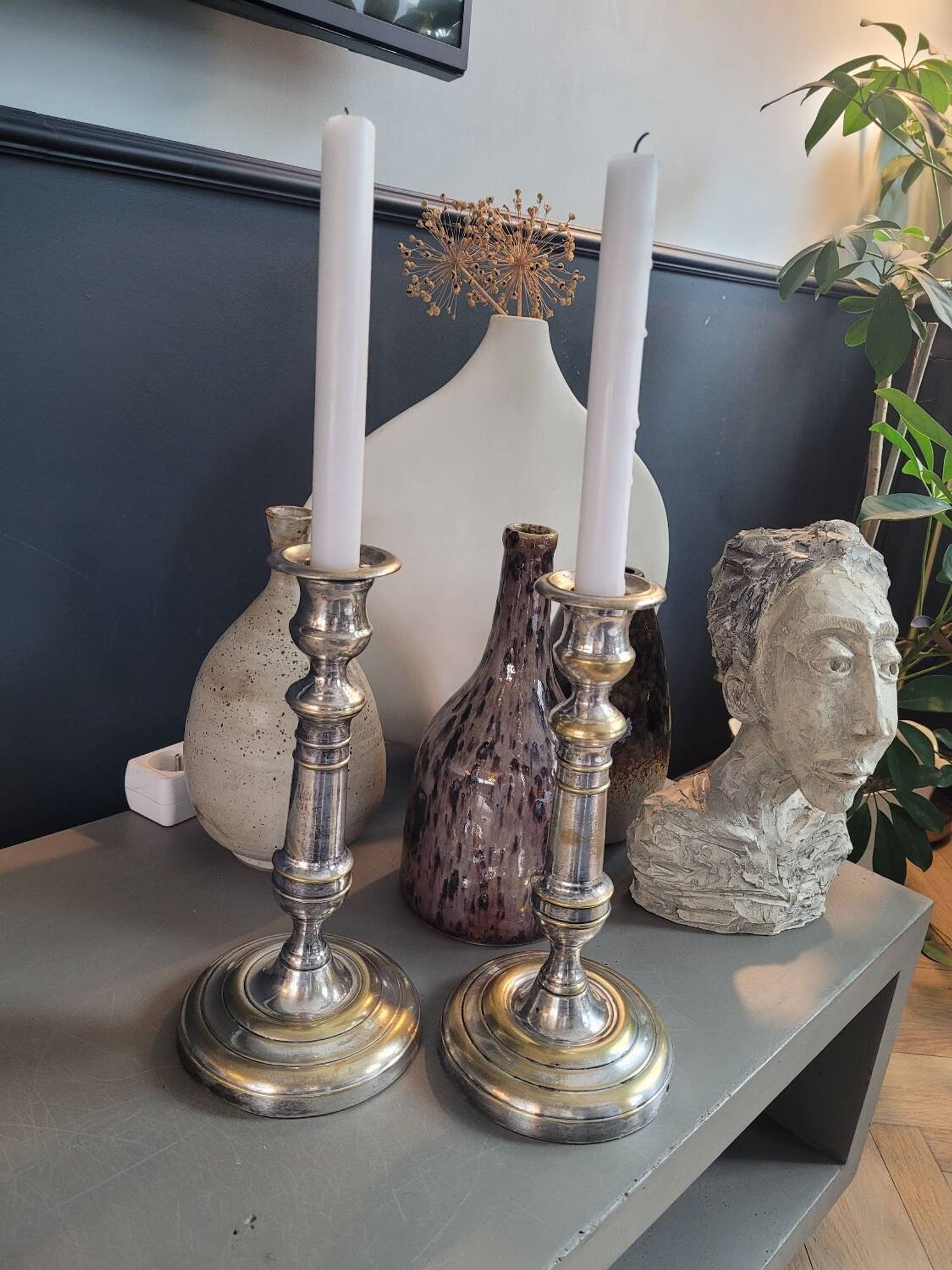 Pair of antique silver-plated brass candlesticks