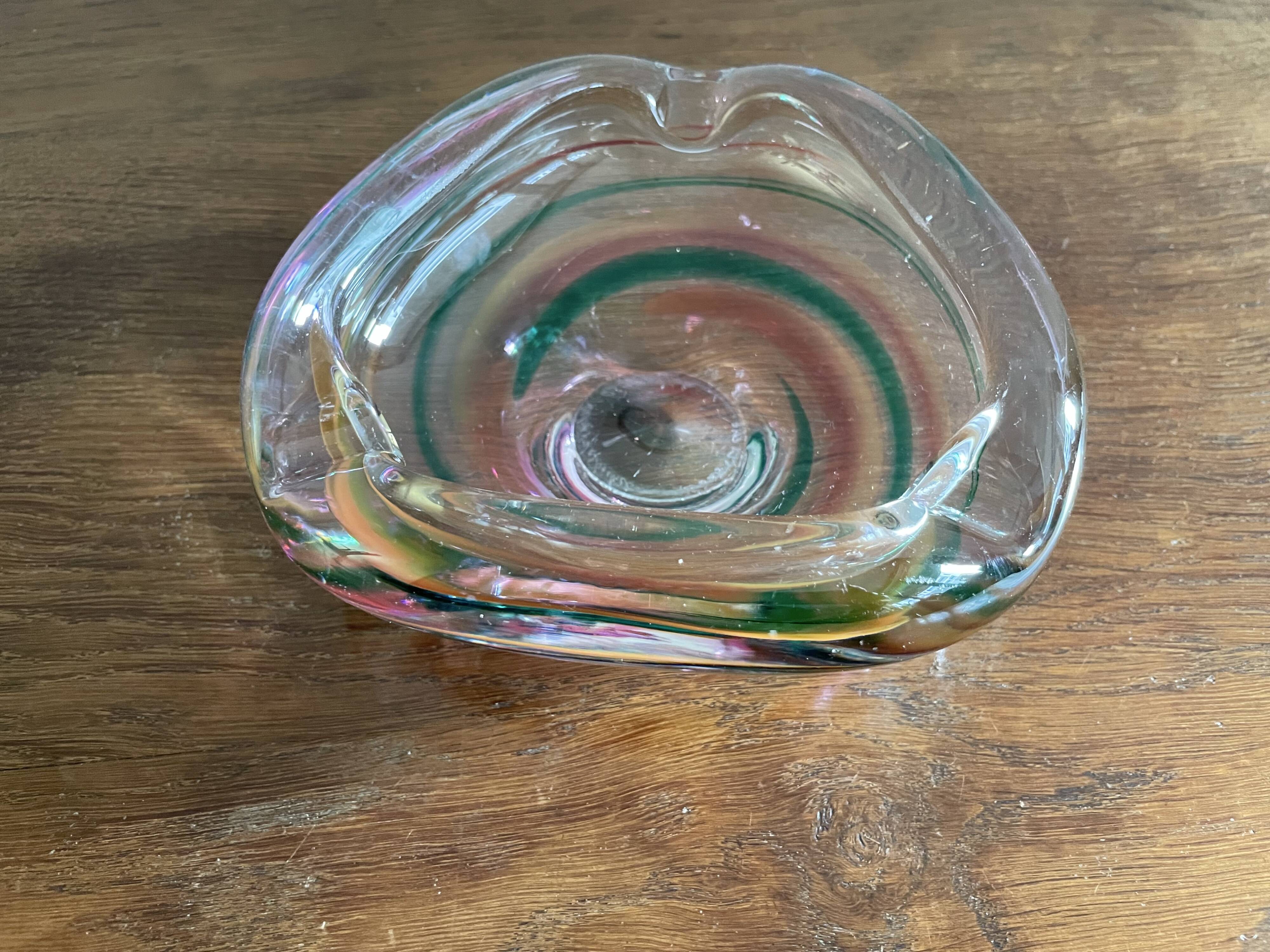 Clear with a soft coloured swirl pattern, round, glass ashtray