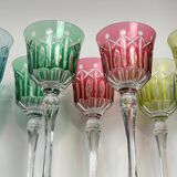 Set of twelve glasses in crystal tinted in different colours and cut with stars.