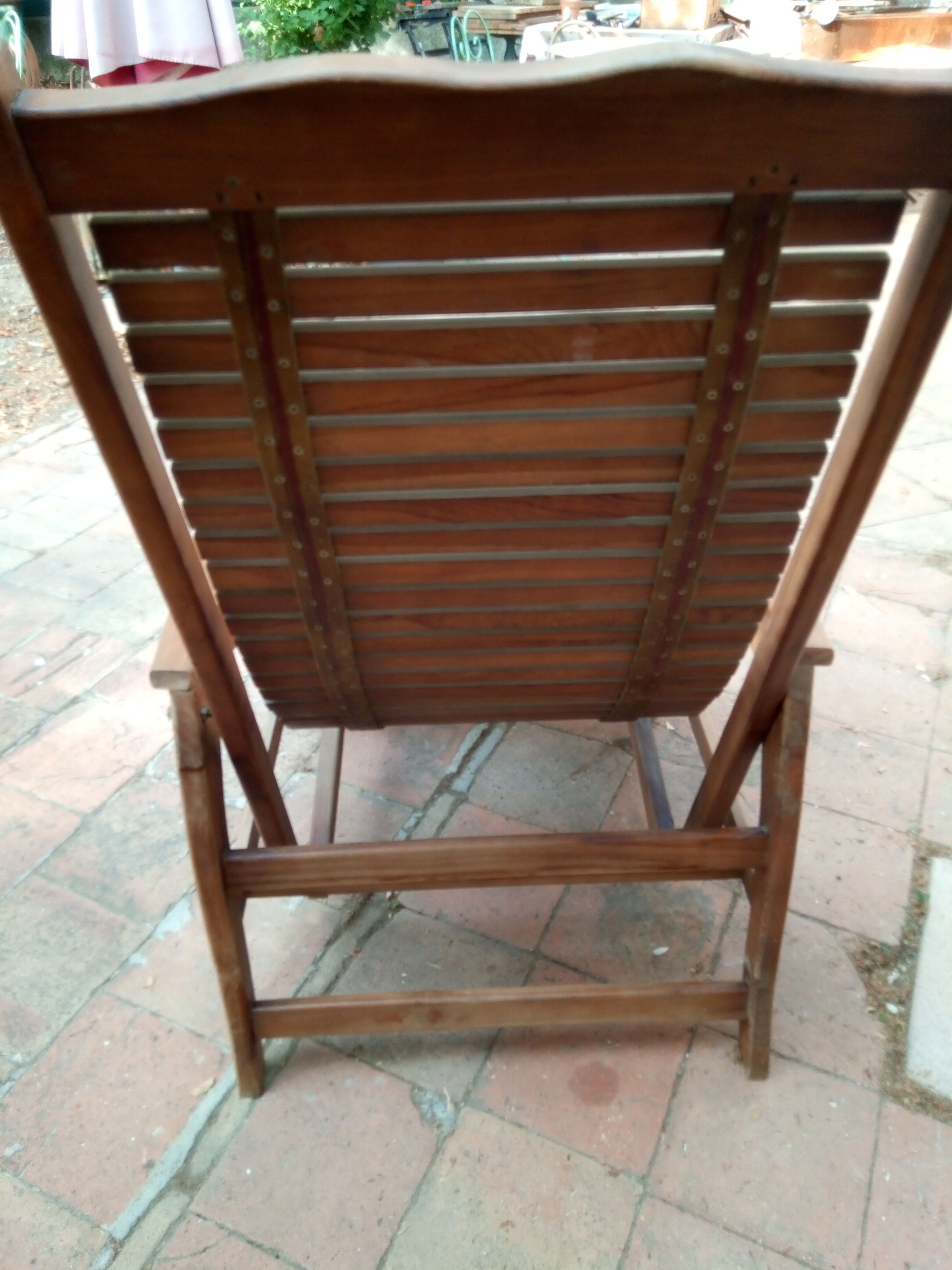 Teak stretchy long chair.