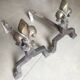 Pair of bronze fireplace firedogs with fleur-de-lys decor, art deco