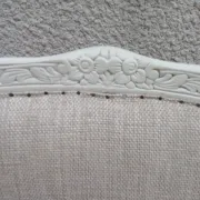 Louis XV style armchair, delicately patinated in a soft beige hue.