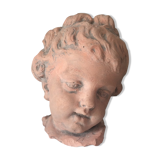 Child bust in plaster