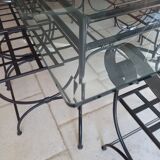 Glass table and wrought iron chairs