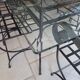 Glass table and wrought iron chairs