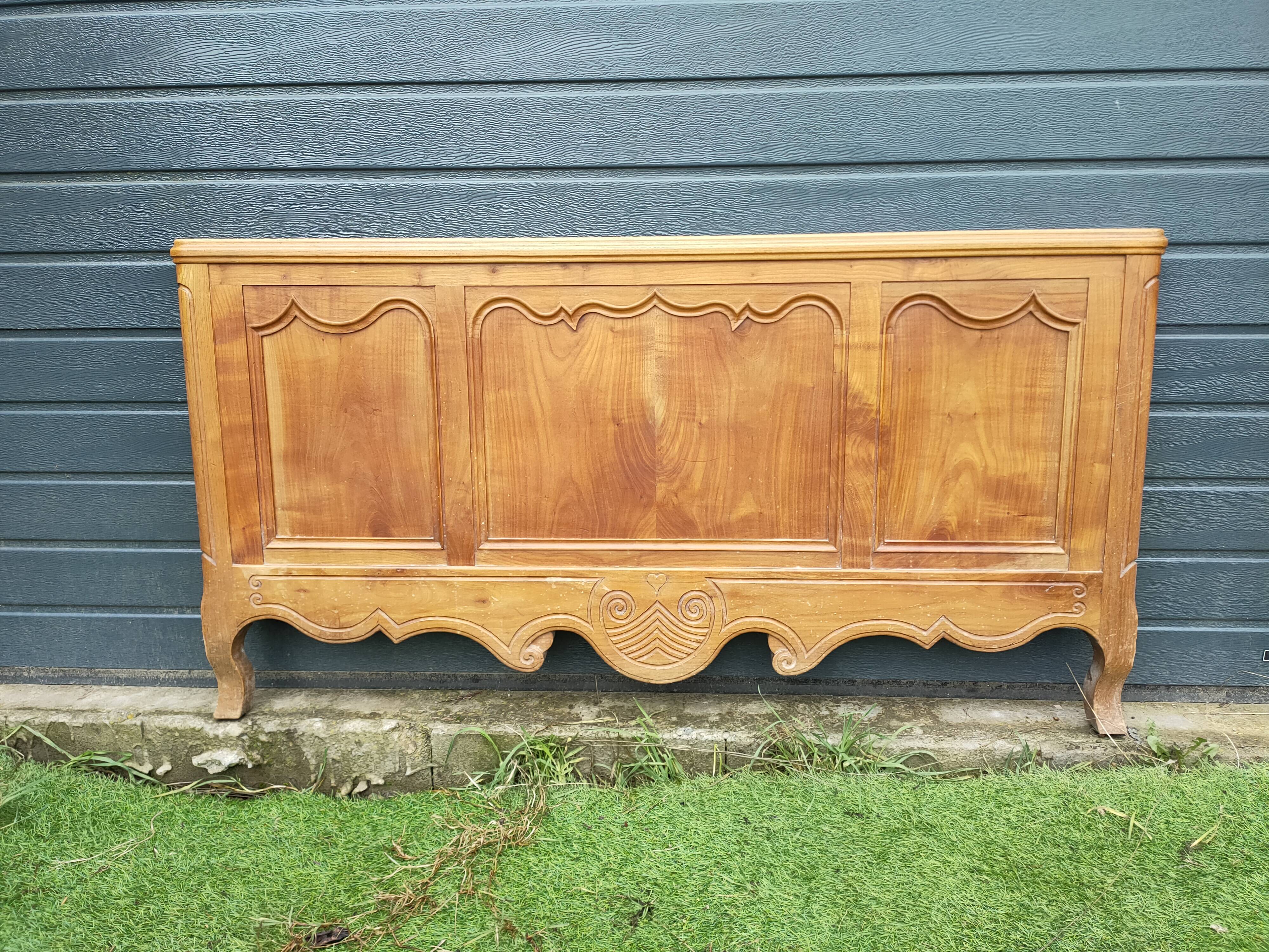 antique headboard in cherry wood