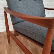 A pair of Danish armchairs, teak, wool, leather
