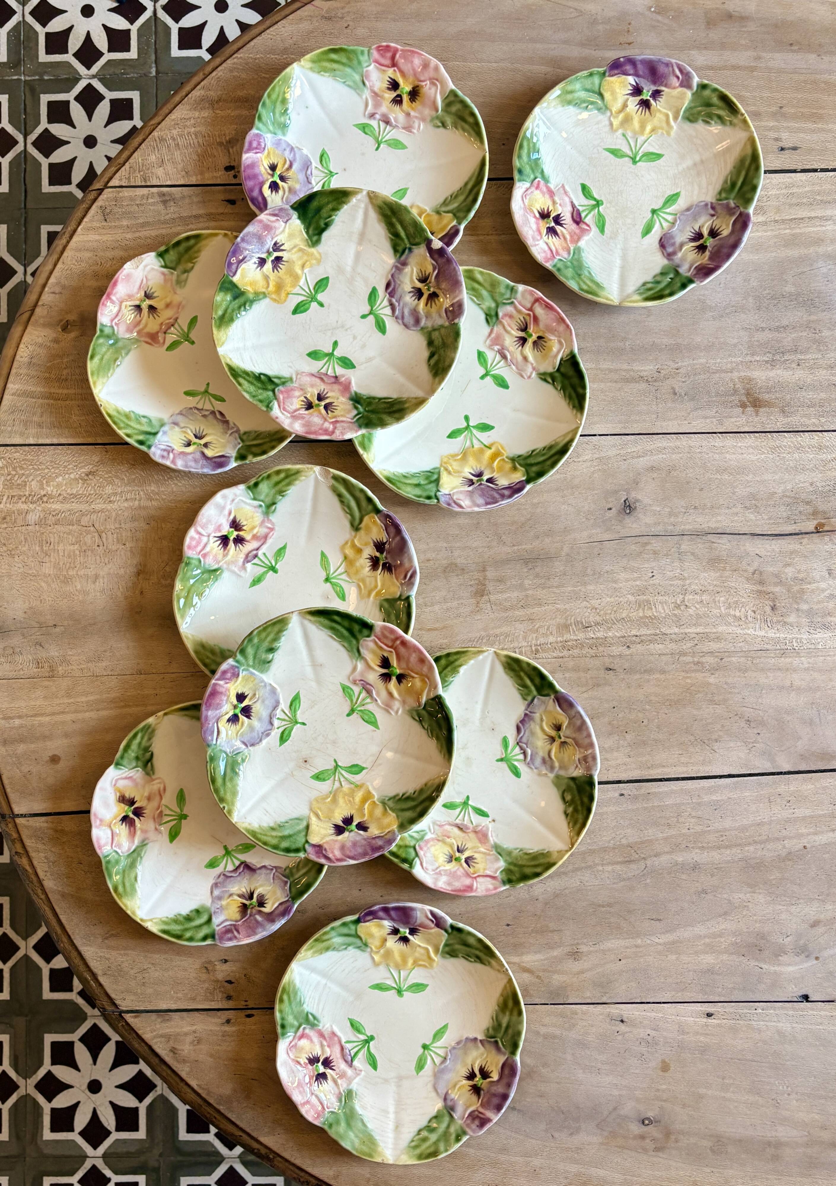 Set of 10 antique slip plates with flower decorations