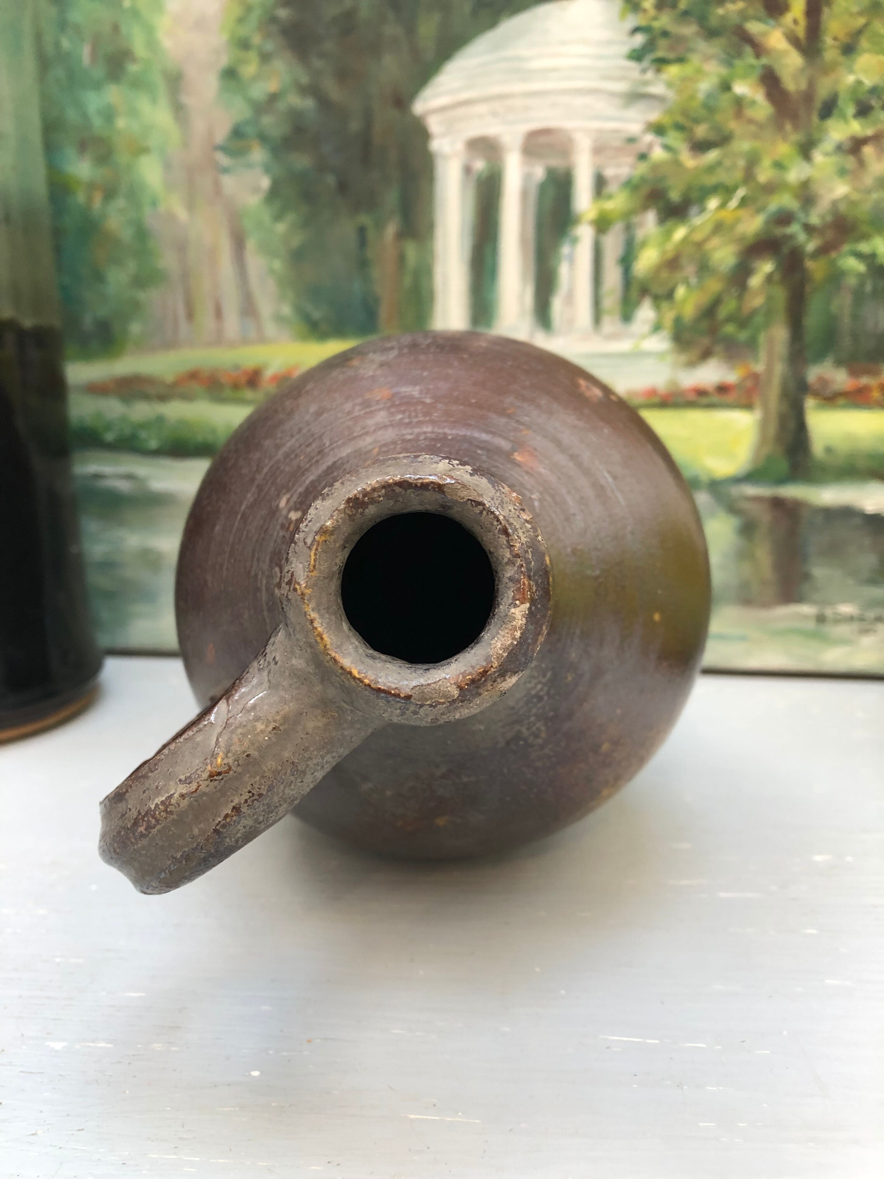 Pitcher in glazed earth in chocolate tones