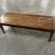 Colonial style teak coffee table - bamboo top under glass