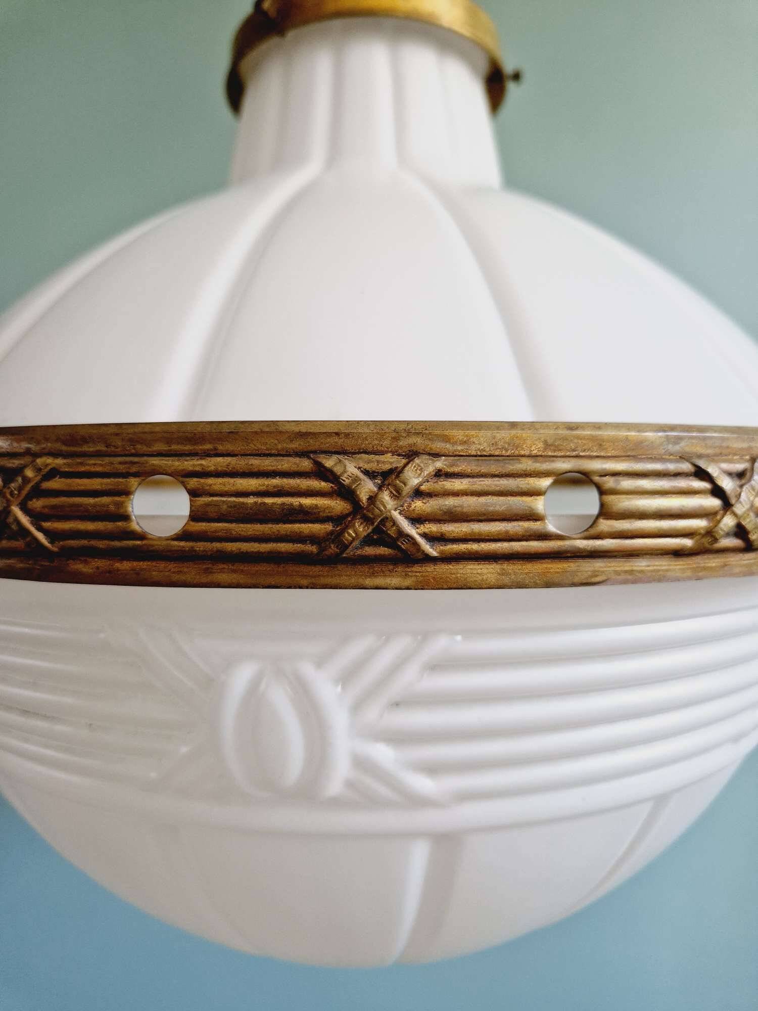 Large Art Deco pendant light in milky glass and brass, 1920