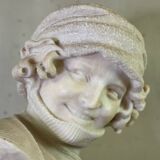 Alabaster bust of a young girl with a turtleneck, signed Caloni, Italy circa 1900