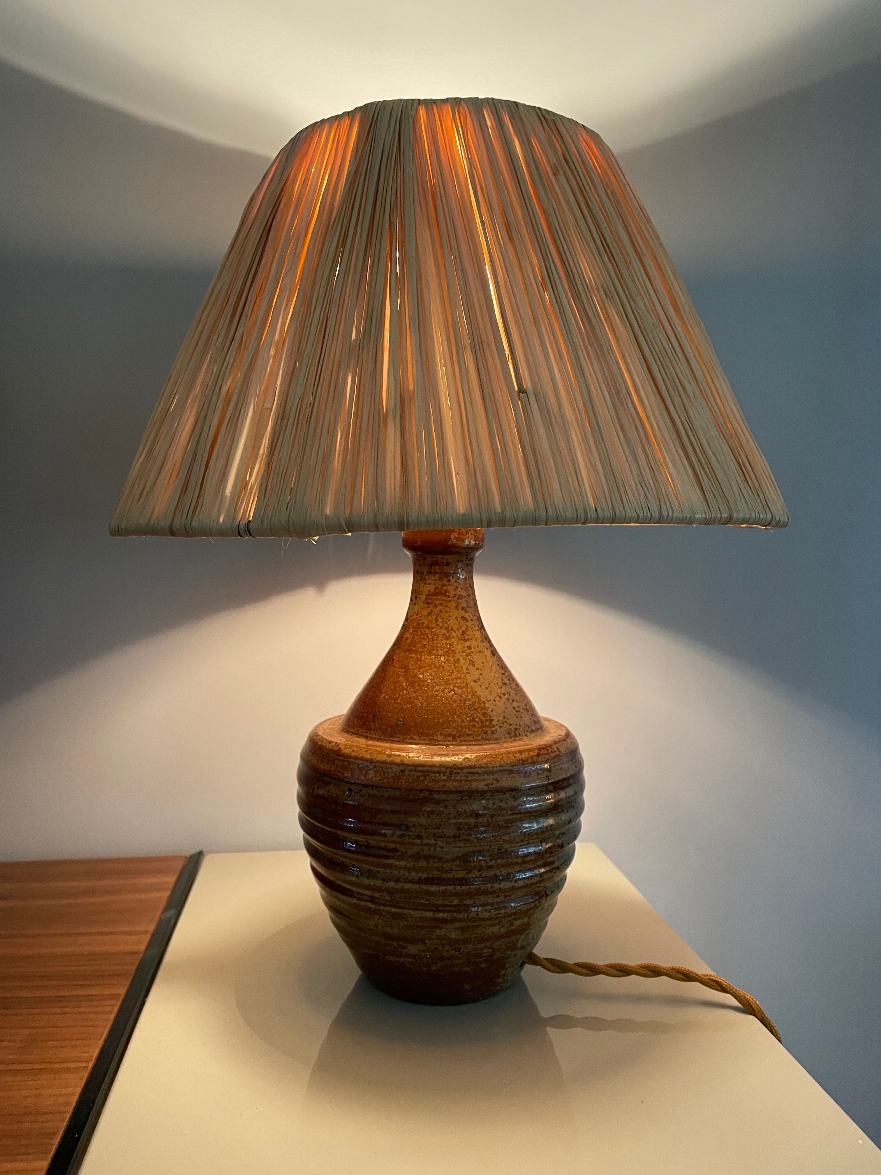 Sandstone lamp and raffia