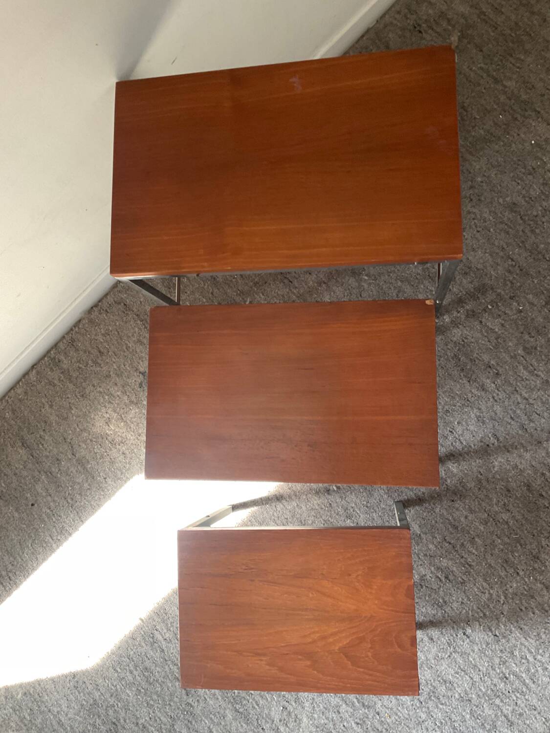 Trio of teak and chrome metal nesting tables from the 60s-70s