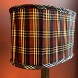 Lamp base in gilded brass, oval silk lampshade with a checkered pattern in burgundy.