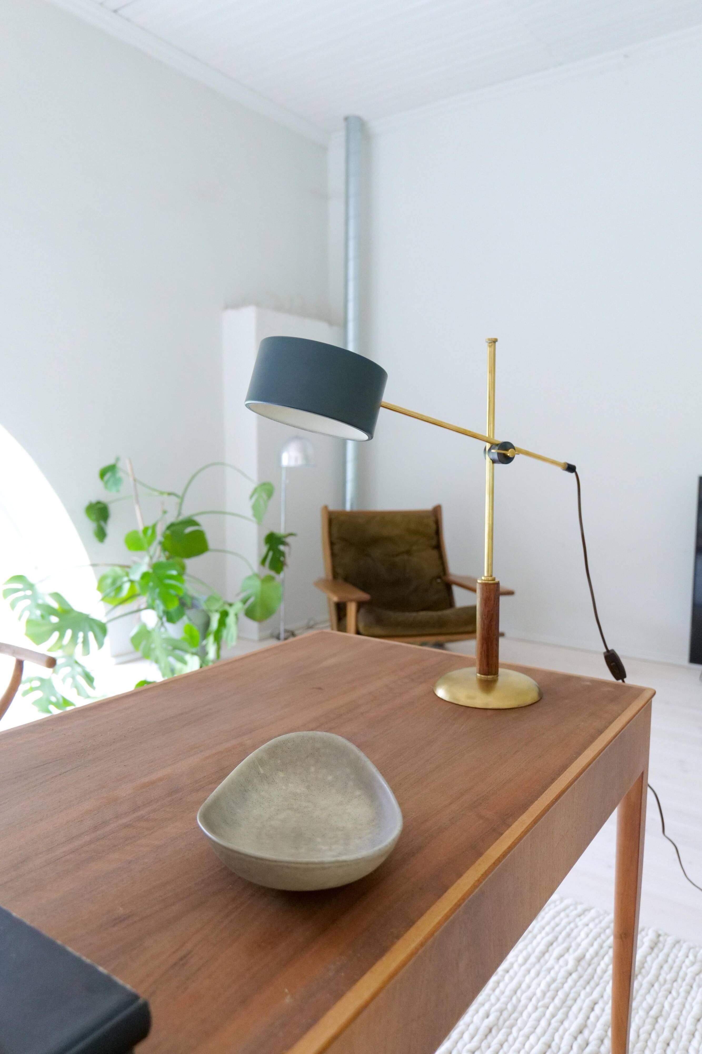Mid-century modern table lamp in brass and walnut, rare by Einar Bäckström, Sweden.