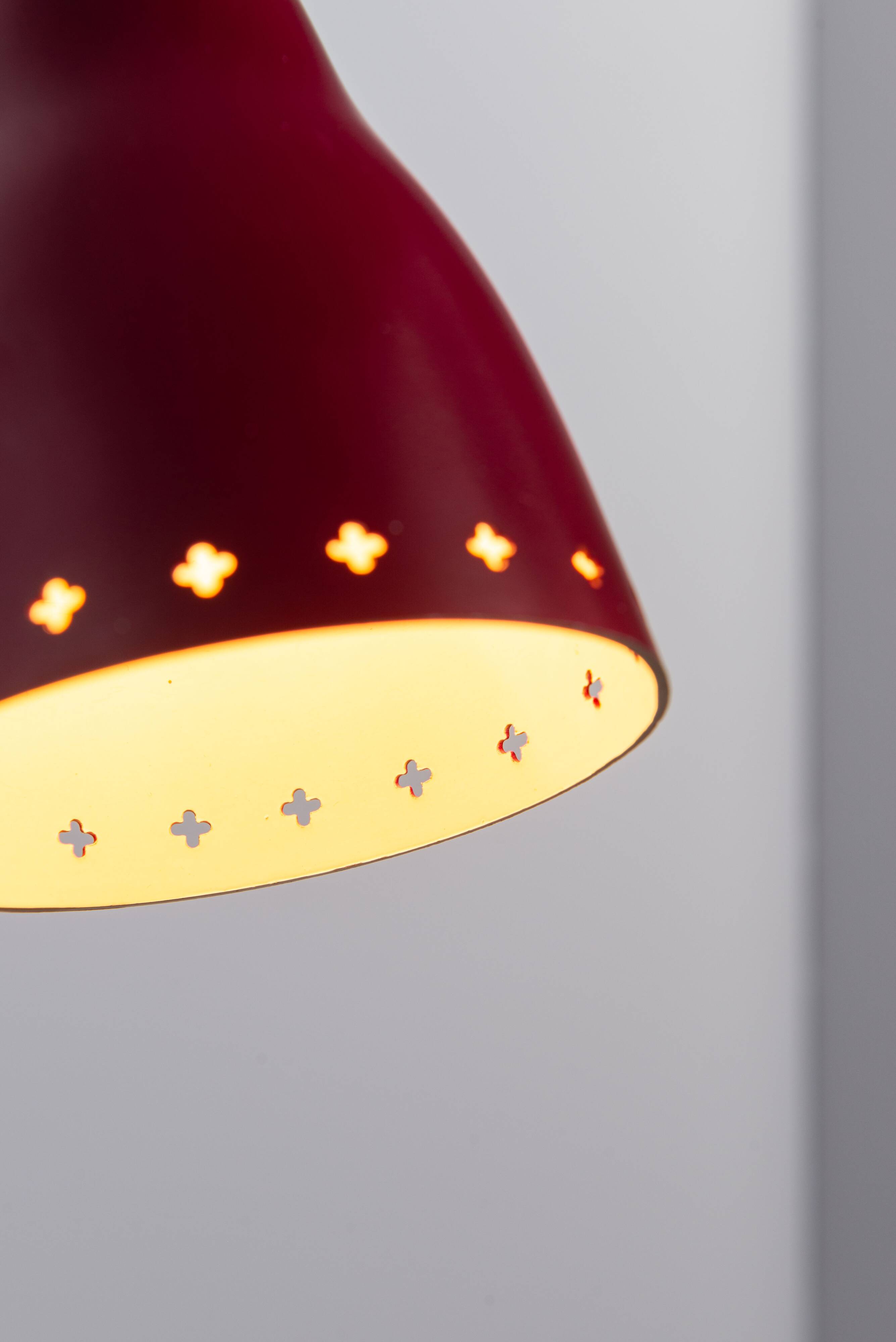 Brass wall lamp with perforated metal shade, 1950s, Sweden