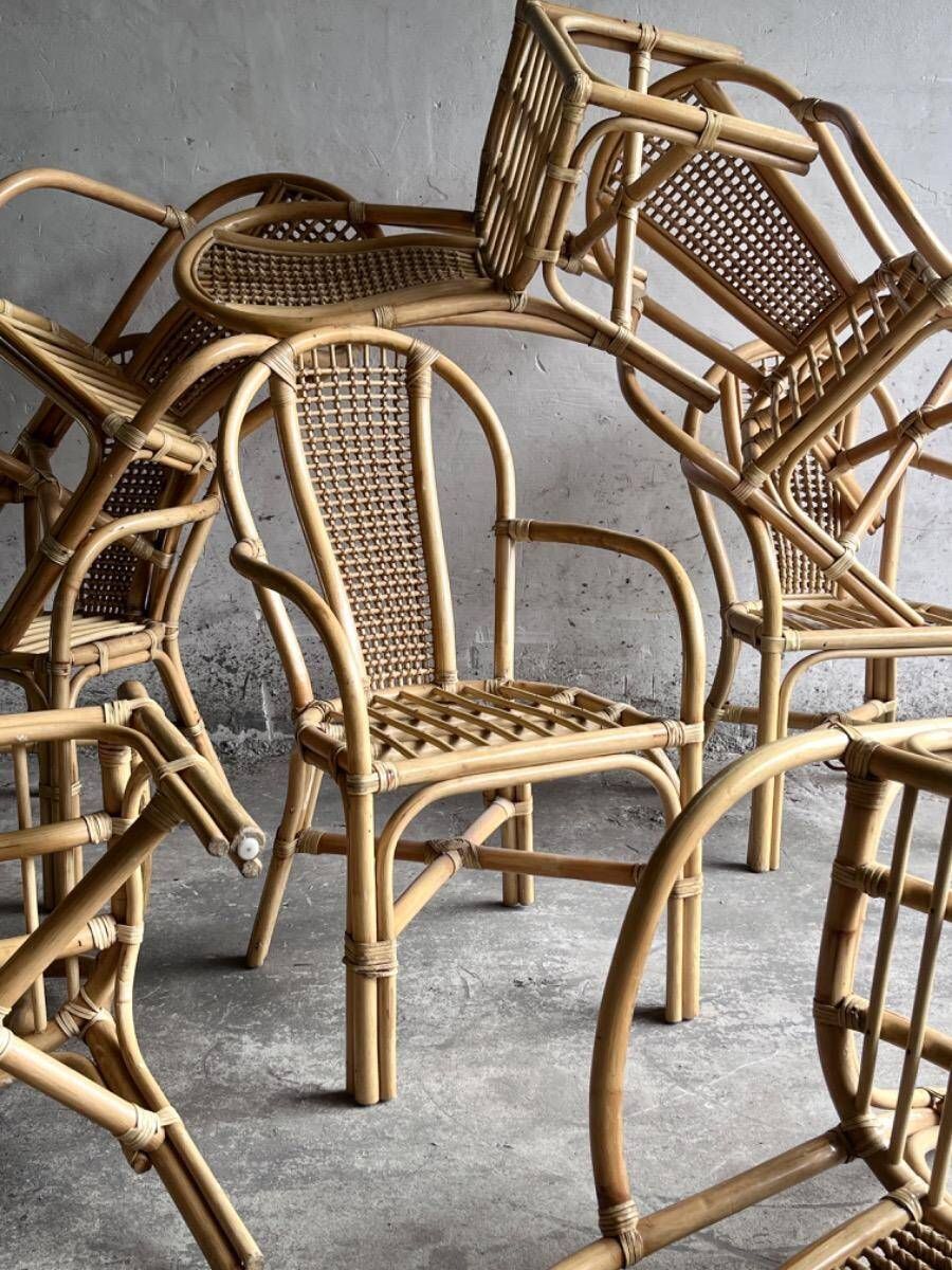 Set of 8 Manou rattan chairs with cane backrest.
