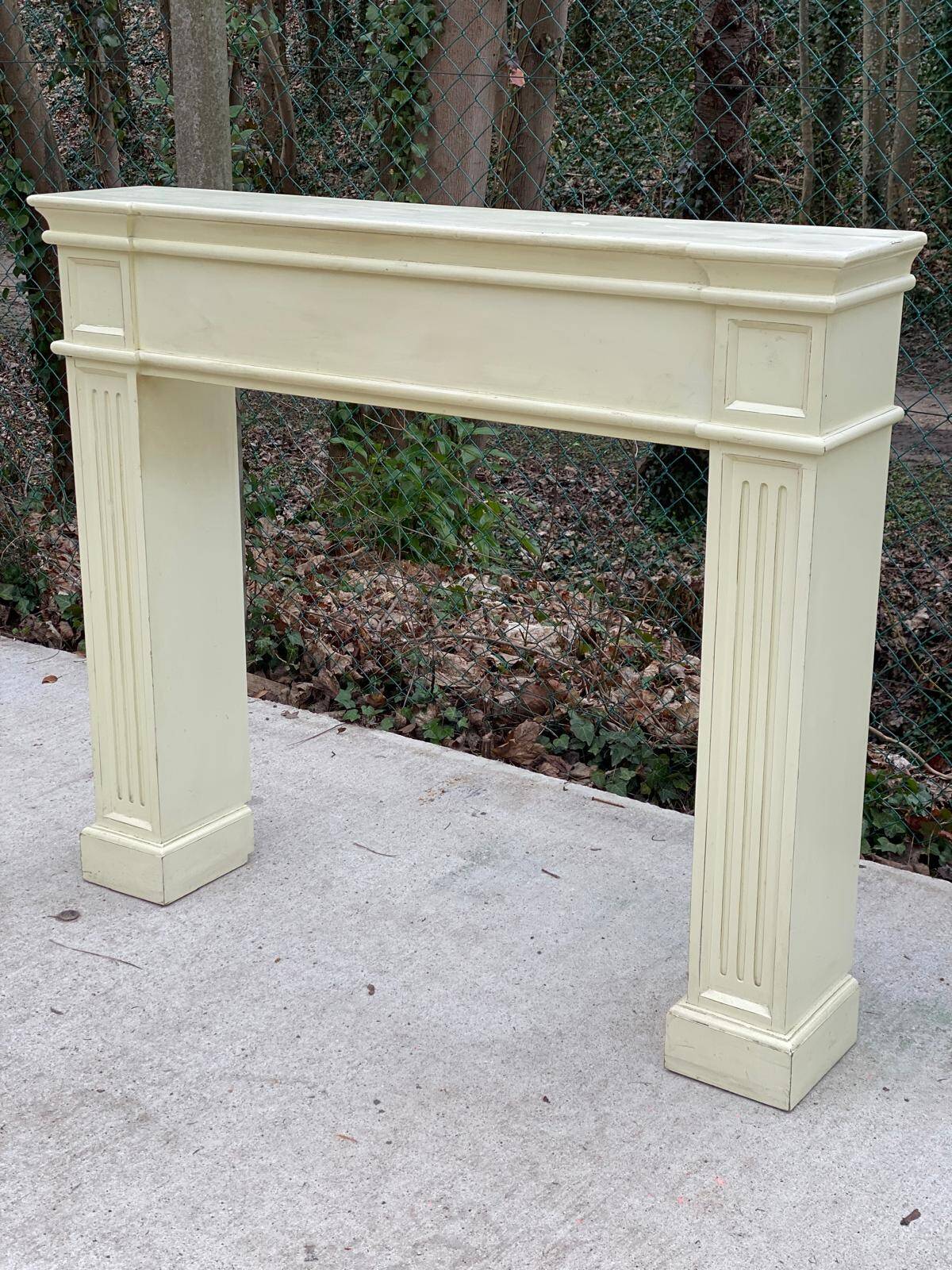 Fireplace surround with beige solid wood mantel