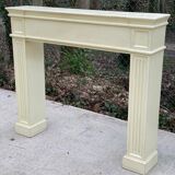 Fireplace surround with beige solid wood mantel