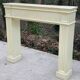 Fireplace surround with beige solid wood mantel
