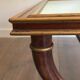 Patinated and gilded carved wooden coffee table. Hirch House.