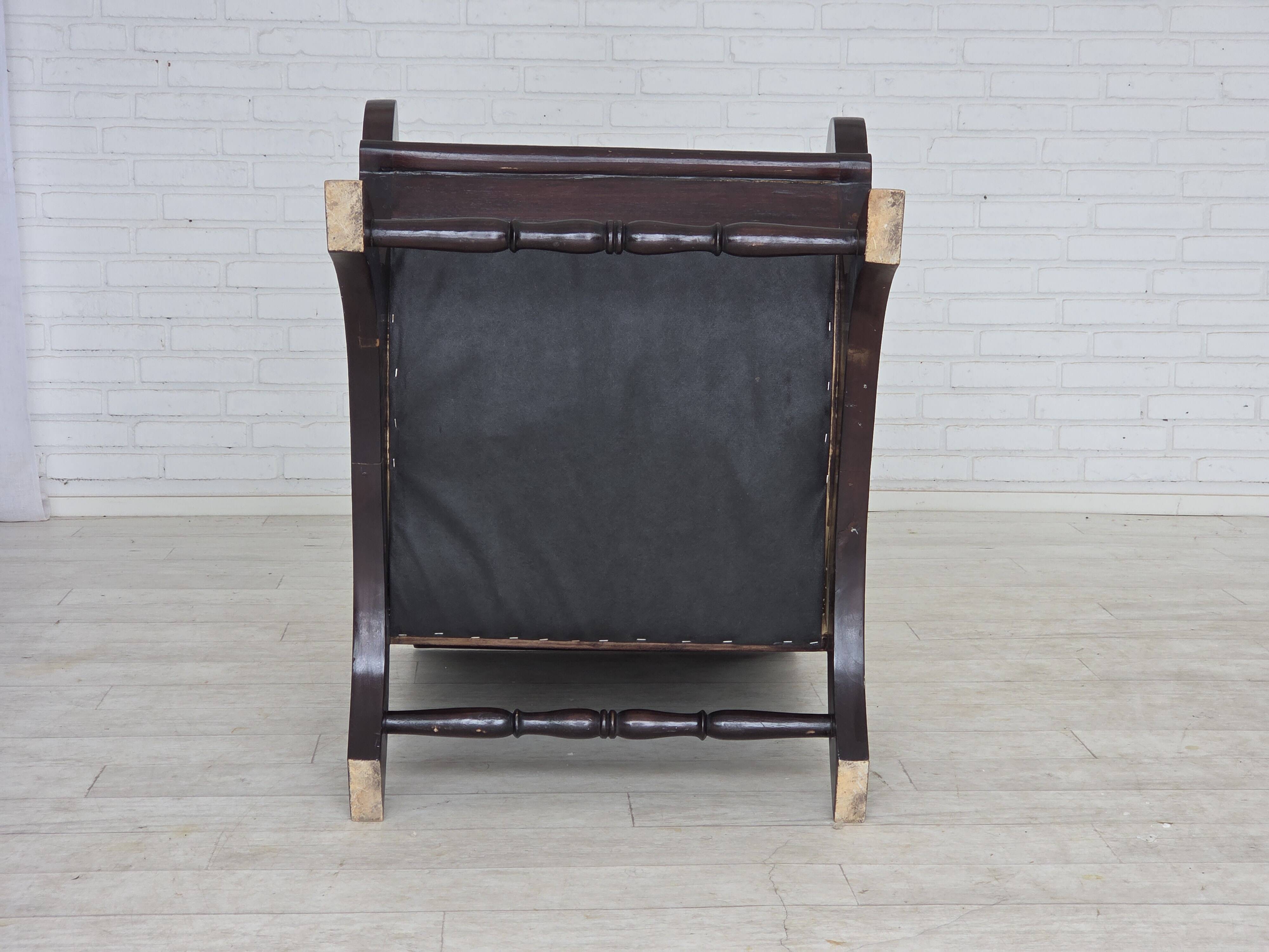 1970s, vintage armchair with footstool, black furniture leather.