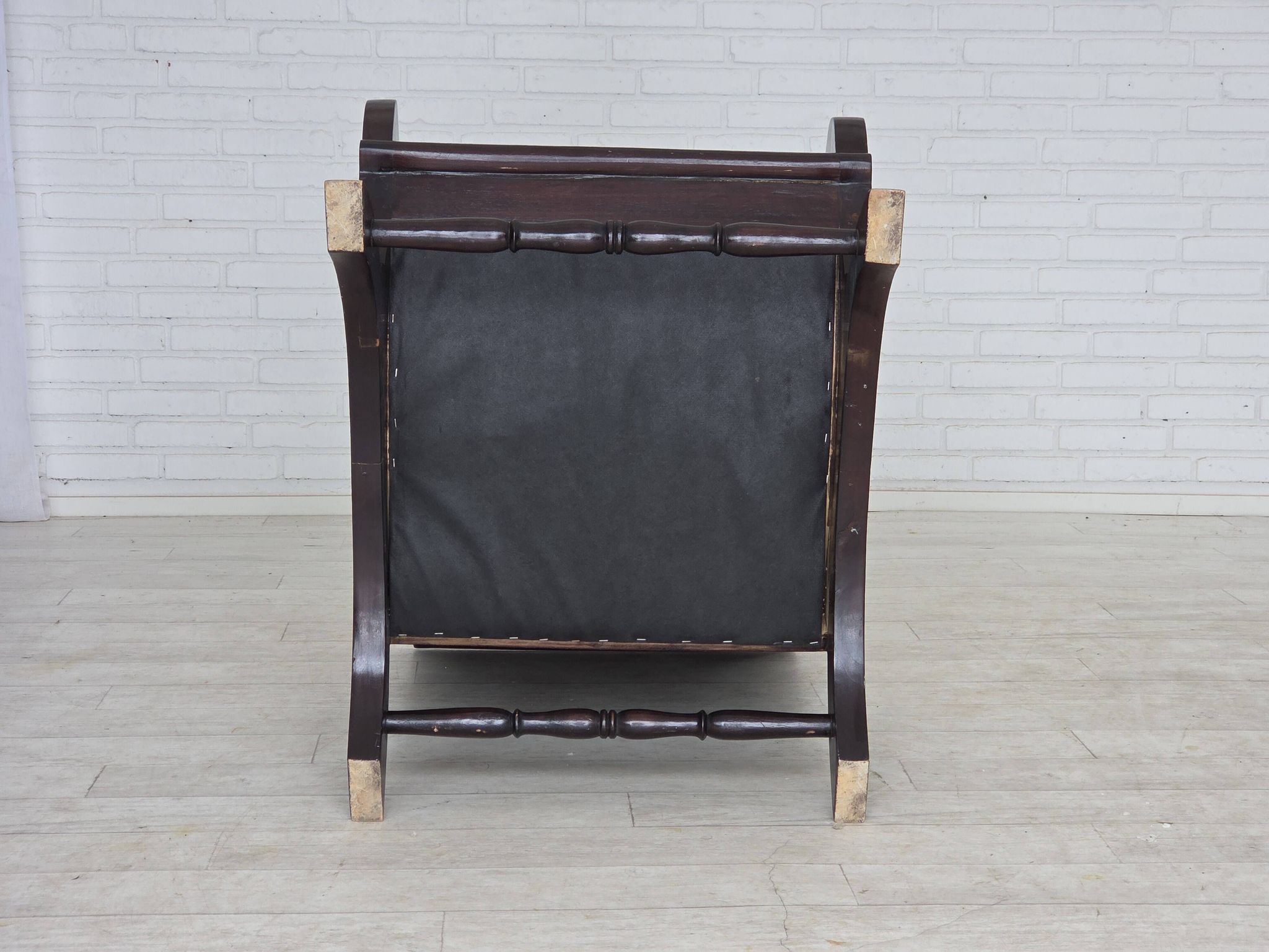 1970s, vintage armchair with footstool, black furniture leather.