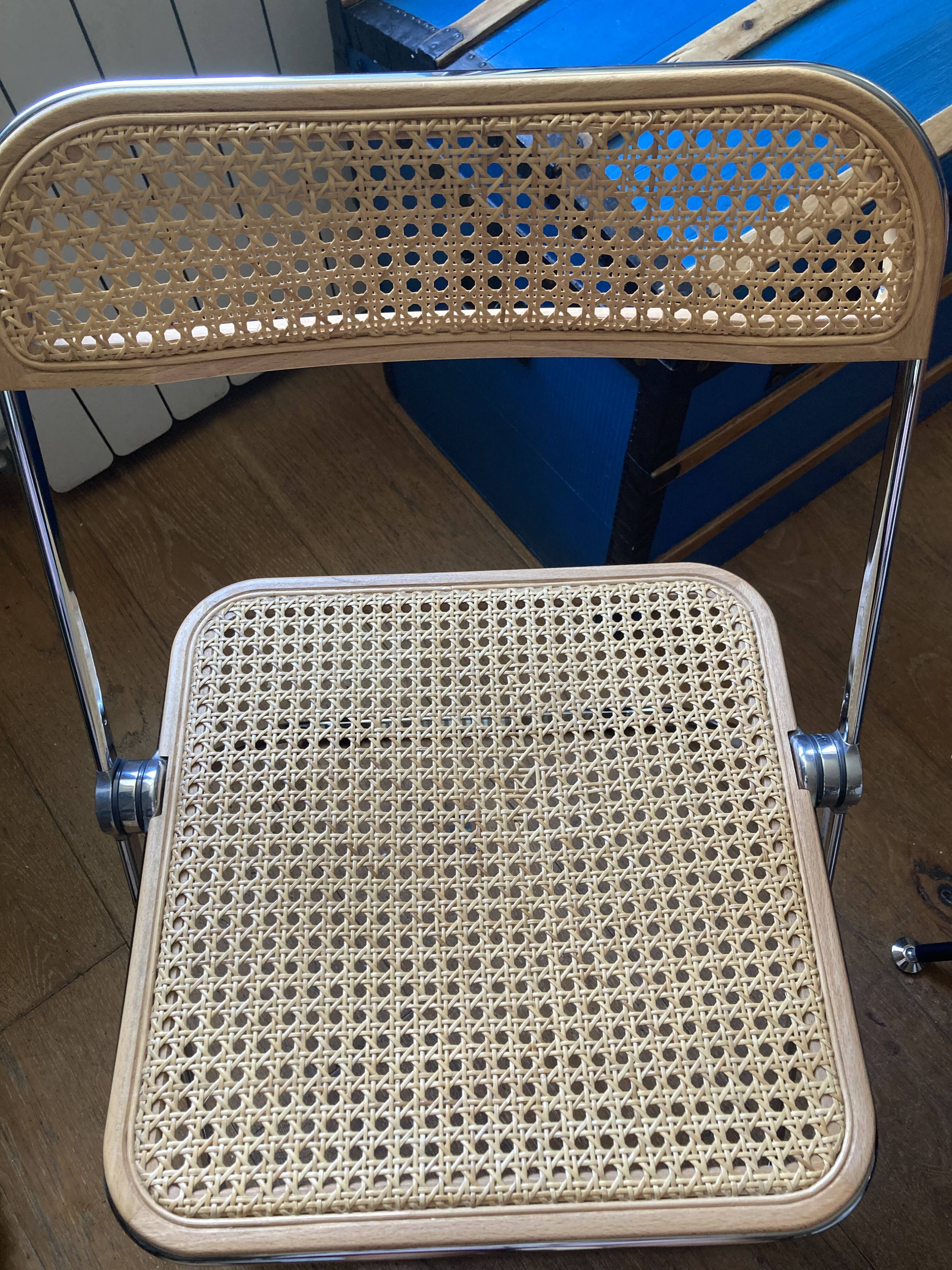 Plia chairs by Castelli in wood and cane.