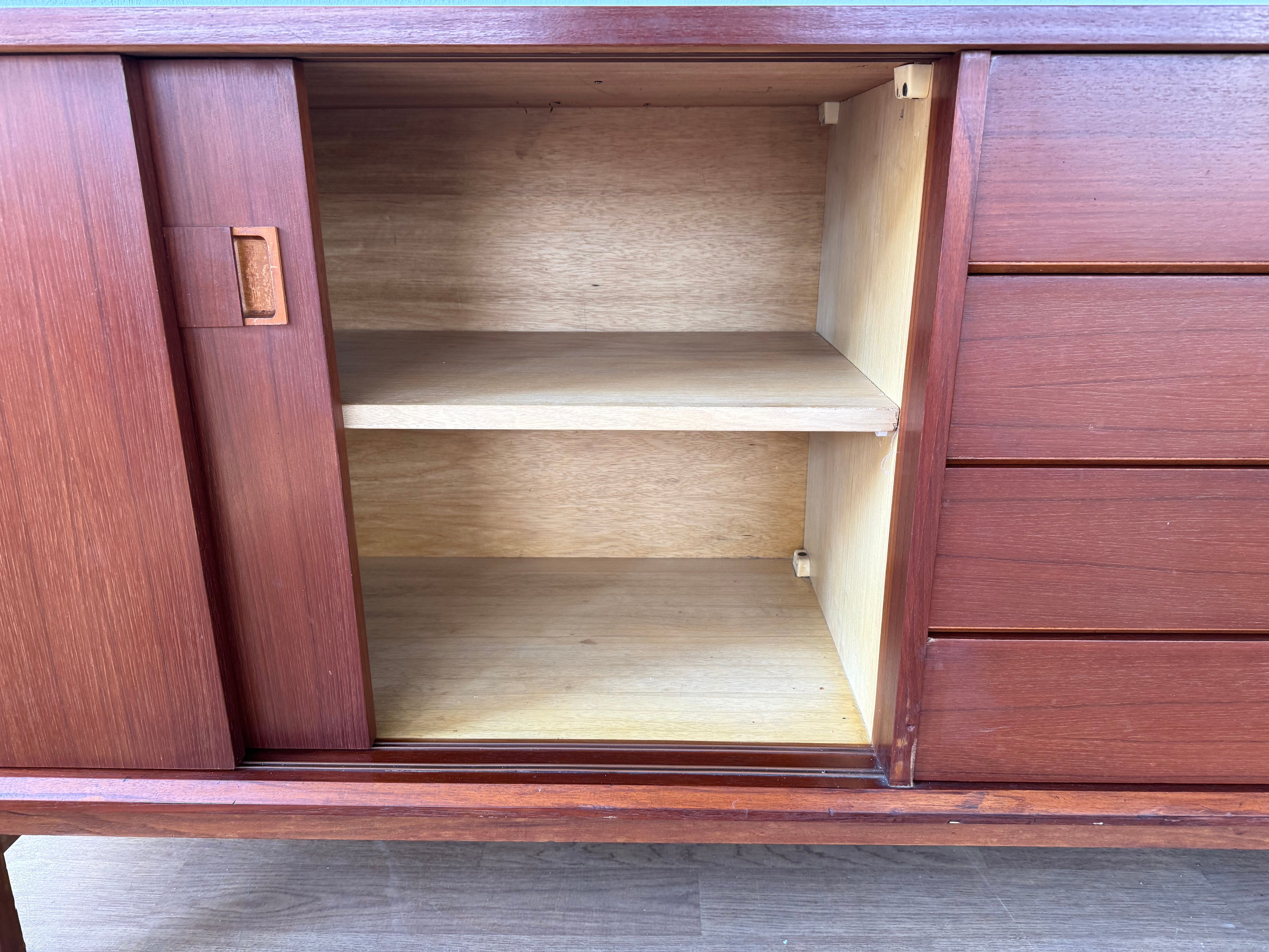 Scandinavian teak sideboard, 230 cm long, with 3 doors and 4 drawers.