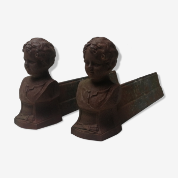 Pair of cast iron fireplace chenets "children"