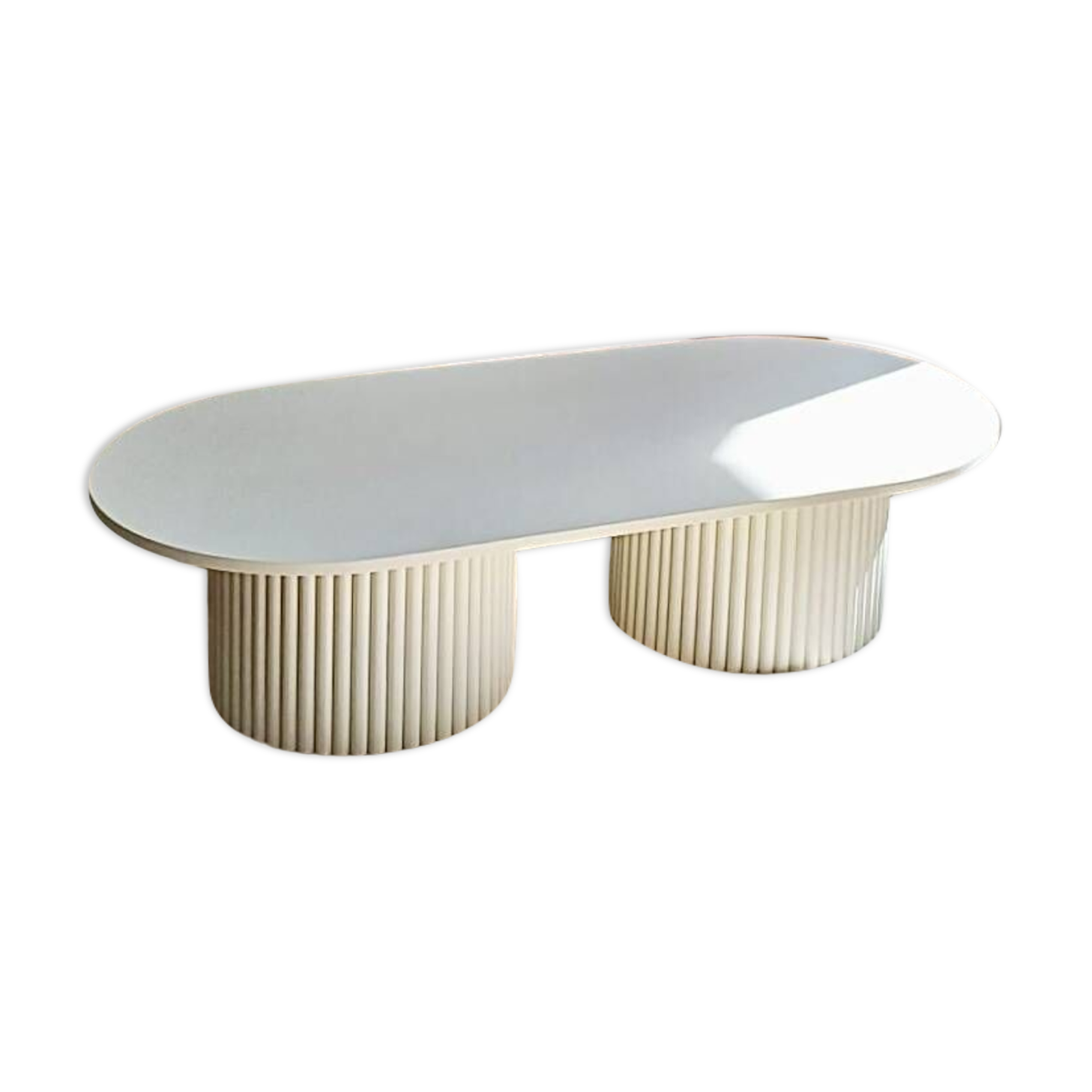 oblong coffee table on 2 fluted bases in light beige