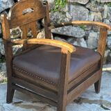 Pair of armchairs in stained wood and leather, 20th century
