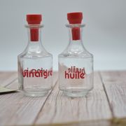 Oil and vinegar with red writing