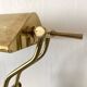 Pair of notary-style lamps in gilded metal