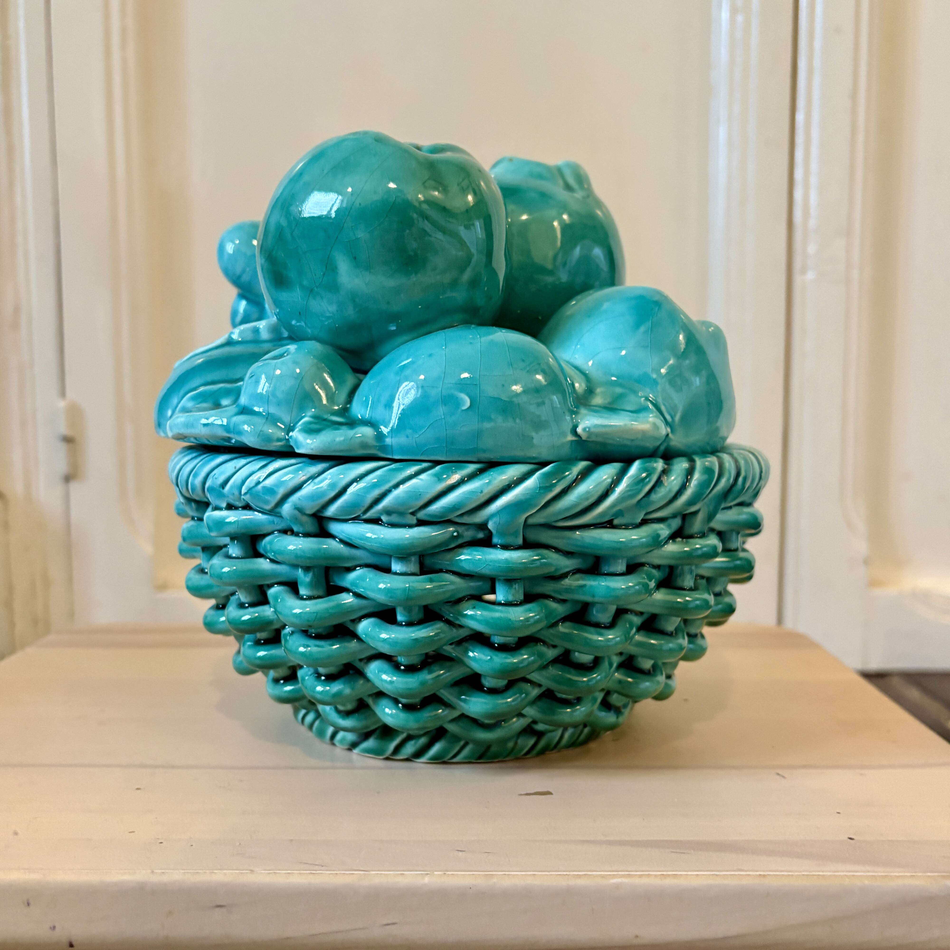 Vintage green earthenware plate/basket with fruit decorations.