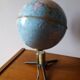 Bright vintage Earth globe brand Vulliermes with metal tripod foot