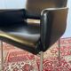 Pair of vintage armchairs in black faux leather and chrome metal.