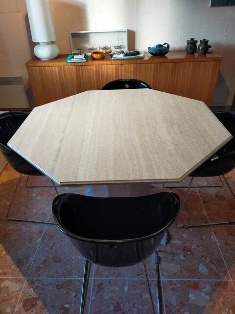Octagonal dining table in travertine