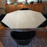 Octagonal dining table in travertine