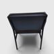 Modernist armchair in black faux leather and metal – 1960s