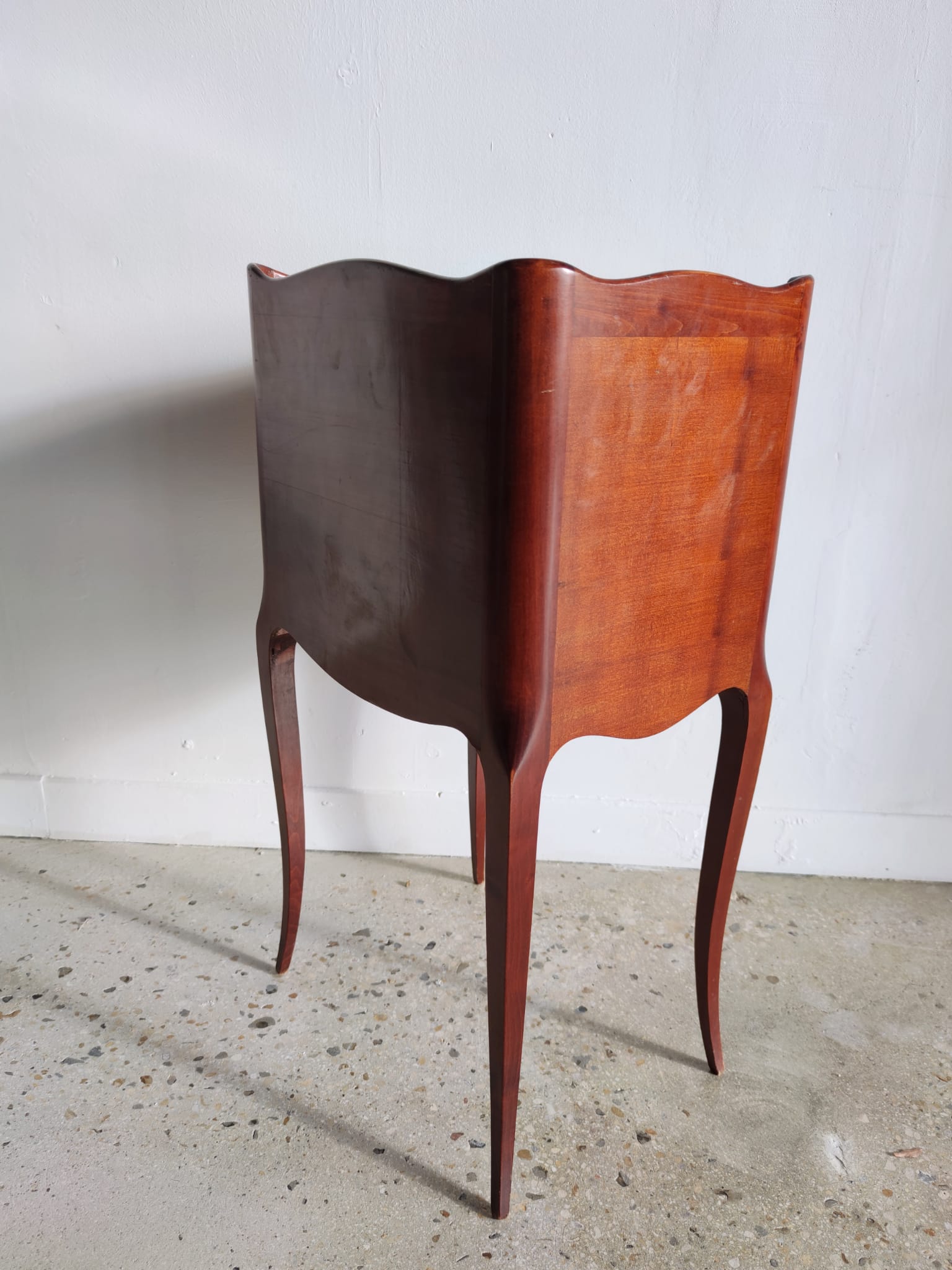 Three-drawer cherry bedside table