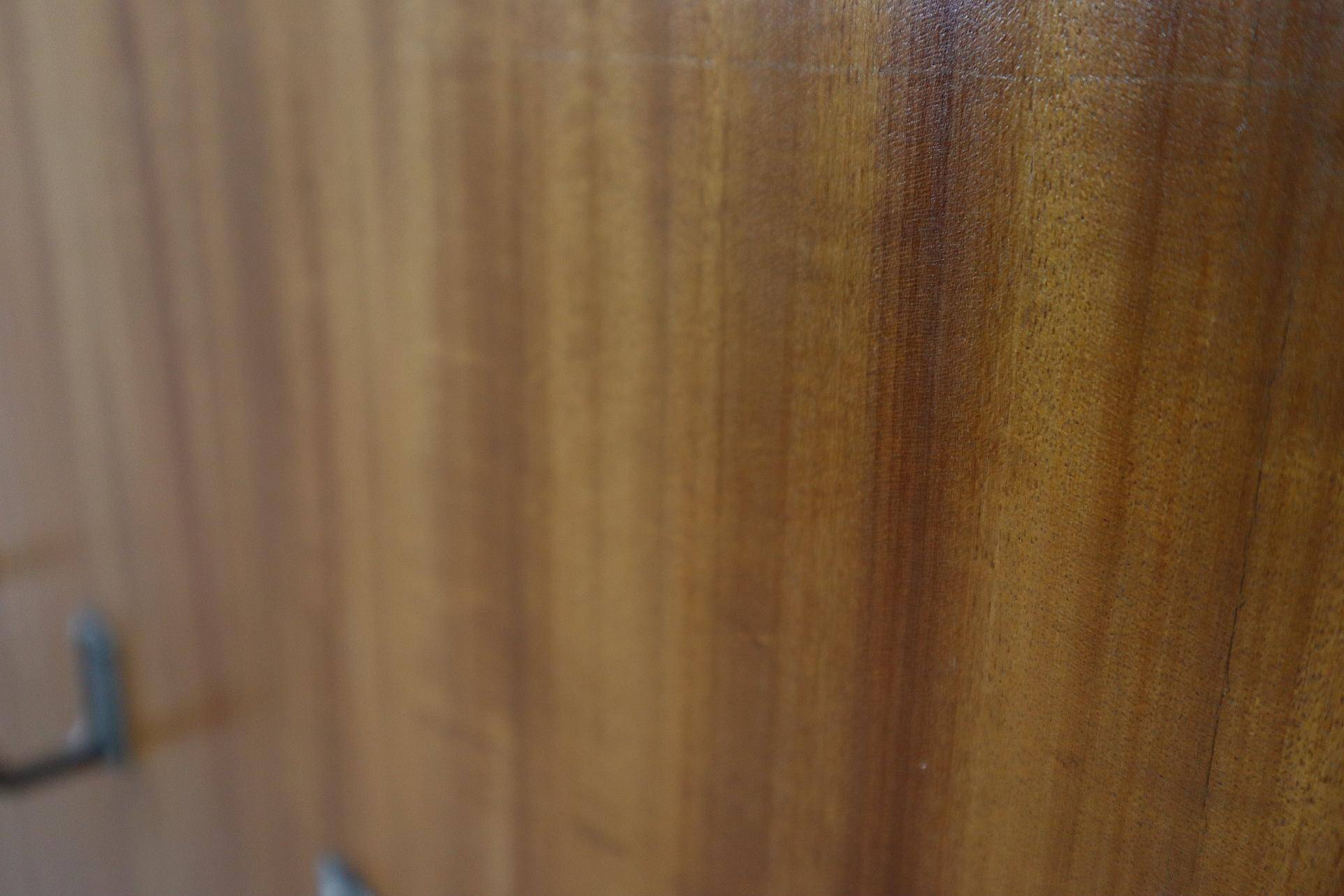 Modernist wall-mounted cloakroom in teak