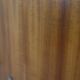 Modernist wall-mounted cloakroom in teak