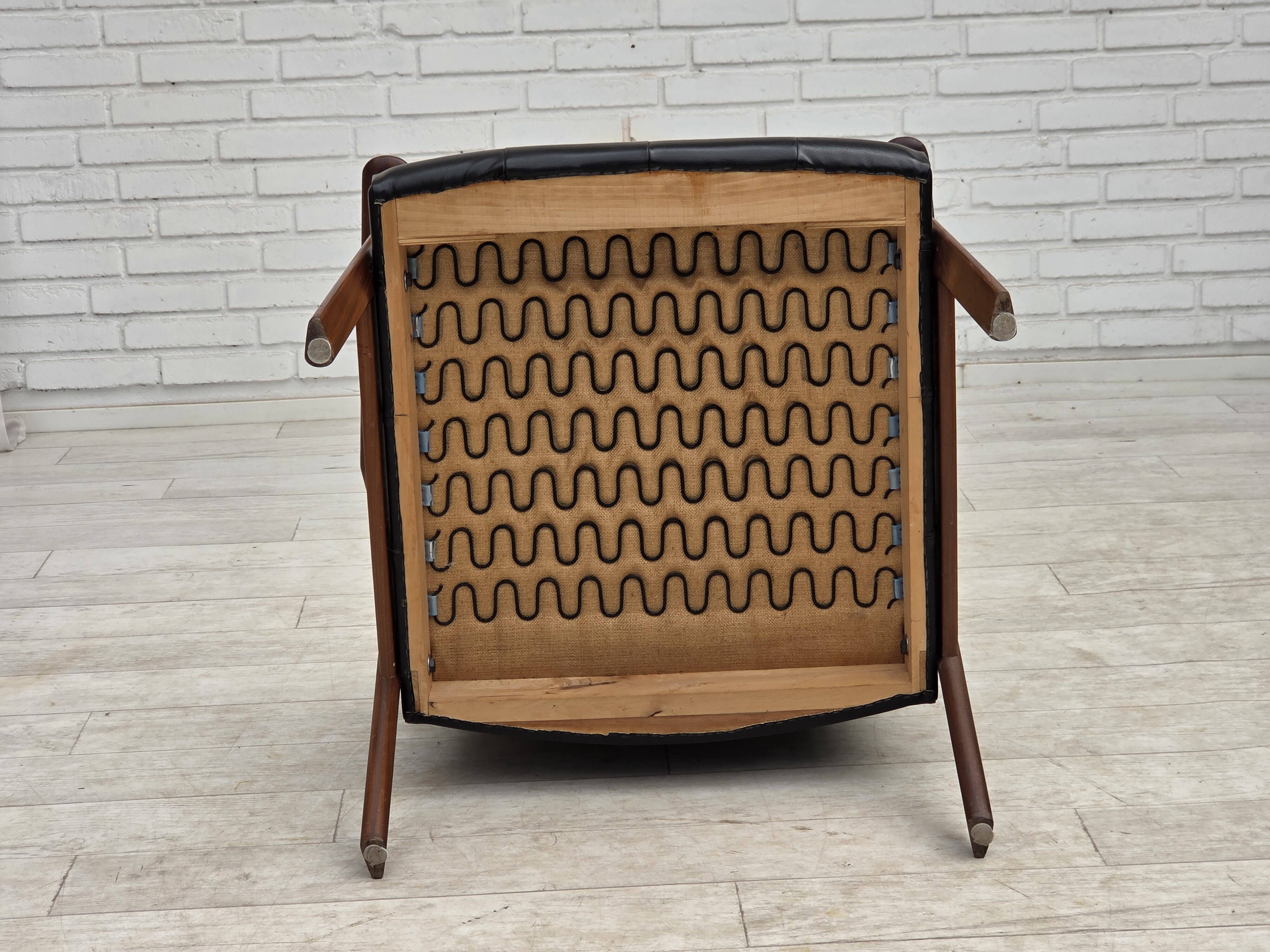 1970s, Danish armchair, black artificial leather, teak wood.
